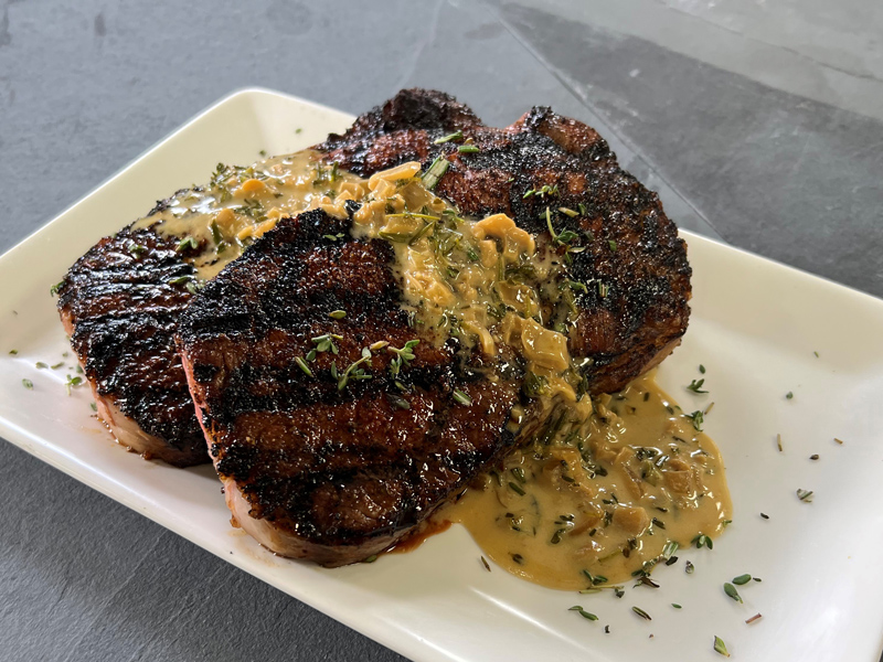 Strip Steaks with Bourbon Peppercorn Sauce